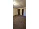 Bedroom with brown carpet and double closets at 710 Seals Rd, Dallas, GA 30157