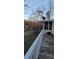 Wooden deck overlooking the backyard with trees at 710 Seals Rd, Dallas, GA 30157