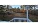 Wooden deck overlooking a large, wooded backyard at 710 Seals Rd, Dallas, GA 30157
