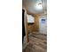 Laundry room with wood paneling, cabinets, and vinyl flooring at 710 Seals Rd, Dallas, GA 30157