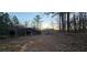Rustic barn with open sides, surrounded by woods at 710 Seals Rd, Dallas, GA 30157