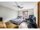 Cozy bedroom with a ceiling fan, a window, and stylish flooring at 1330 Hillcrest Dr, Sugar Hill, GA 30518