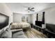 Bedroom with multiple windows, wood-look flooring, and a modern aesthetic at 1330 Hillcrest Dr, Sugar Hill, GA 30518