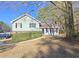 Ranch style home with brick and light green siding, situated on a landscaped lot at 1330 Hillcrest Dr, Sugar Hill, GA 30518