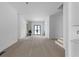 Bright entry hall with modern black framed doors and staircase at 223 Altoona Sw Pl, Atlanta, GA 30314