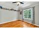 Bedroom with hardwood floors and a large window at 90 Bentgrass Ct, Dallas, GA 30157