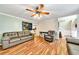 Living room with hardwood floors, gray couches, and ceiling fan at 90 Bentgrass Ct, Dallas, GA 30157