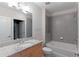 Bathroom boasts granite countertop, tub and shower at 400 W Peachtree Nw St # 2303, Atlanta, GA 30308