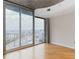 Bright living room with hardwood floors and city views at 400 W Peachtree Nw St # 2303, Atlanta, GA 30308