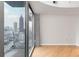 Bright living room with hardwood floors and city views at 400 W Peachtree Nw St # 2303, Atlanta, GA 30308