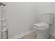 Simple, clean bathroom with a toilet and tile floor at 860 N Bethany Rd, Mcdonough, GA 30252