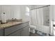 Clean bathroom with granite countertop and tub shower combo at 860 N Bethany Rd, Mcdonough, GA 30252