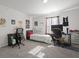 Simple bedroom with a bed, desk, and chair at 860 N Bethany Rd, Mcdonough, GA 30252