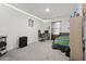 Bright bedroom featuring a bed, desk, and closet at 860 N Bethany Rd, Mcdonough, GA 30252