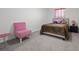 Bedroom with a queen bed and sitting area at 860 N Bethany Rd, Mcdonough, GA 30252