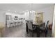 Kitchen and dining area with breakfast bar and modern lighting at 860 N Bethany Rd, Mcdonough, GA 30252