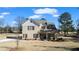 Two-story brick home with front porch and landscaped yard at 860 N Bethany Rd, Mcdonough, GA 30252