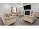 Living room with fireplace, stylish furniture, and hardwood floors at 860 N Bethany Rd, Mcdonough, GA 30252