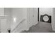 Upstairs hallway with carpet, a door, and a mirror at 860 N Bethany Rd, Mcdonough, GA 30252