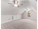 Finished attic space with neutral carpet, windows, and recessed lighting offer versatility for various needs at 1630 Bettis Tribble Gap Rd, Cumming, GA 30040