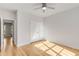 Bright bedroom with hardwood floors and a ceiling fan for added comfort at 1630 Bettis Tribble Gap Rd, Cumming, GA 30040