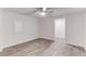 Bedroom showcasing wood-look flooring and an open doorway at 1630 Bettis Tribble Gap Rd, Cumming, GA 30040