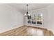 Empty dining room with large windows and hardwood floors, bathed in natural light at 1630 Bettis Tribble Gap Rd, Cumming, GA 30040