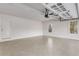 Spacious garage featuring an epoxy floor and natural light at 1630 Bettis Tribble Gap Rd, Cumming, GA 30040