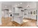 Open-concept kitchen with a center island and views of the dining area at 1630 Bettis Tribble Gap Rd, Cumming, GA 30040