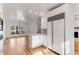 Spacious open kitchen with stainless appliances and view of the adjacent dining room at 1630 Bettis Tribble Gap Rd, Cumming, GA 30040