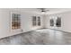 Bright living room featuring windows and glass doors to the outdoors at 1630 Bettis Tribble Gap Rd, Cumming, GA 30040