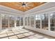 Sunroom featuring a wood ceiling, tile flooring, and a wall of windows with views at 1630 Bettis Tribble Gap Rd, Cumming, GA 30040