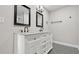 Charming bathroom featuring double vanity with granite countertop and stylish patterned flooring at 2183 Pansy Nw St, Atlanta, GA 30314