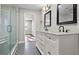 Bright bathroom featuring double vanity with granite countertop and glass enclosed shower at 2183 Pansy Nw St, Atlanta, GA 30314