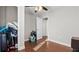 A cluttered bedroom featuring hardwood floors and a ceiling fan at 2183 Pansy Nw St, Atlanta, GA 30314