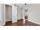 Bright bedroom featuring hardwood floors, a spacious closet, and natural light streaming through the window at 2183 Pansy Nw St, Atlanta, GA 30314