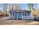 Charming home with light blue siding, a matching door, and a cozy white porch railing at 2183 Pansy Nw St, Atlanta, GA 30314