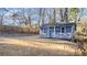 View of a cute home featuring light blue siding, white trim, and well-maintained landscaping at 2183 Pansy Nw St, Atlanta, GA 30314