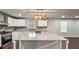 Spacious kitchen with stainless steel appliances, gray backsplash, and a large center island at 2183 Pansy Nw St, Atlanta, GA 30314