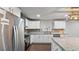 Updated kitchen features stainless steel appliances, granite counters, subway tile, and modern lighting at 2183 Pansy Nw St, Atlanta, GA 30314