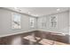 Spacious living room with hardwood floors, recessed lighting, and large windows, creating a bright and airy atmosphere at 2183 Pansy Nw St, Atlanta, GA 30314