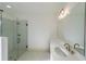Bathroom with double vanity, large mirror, and frameless shower at 5470 Crow Dr, Cumming, GA 30041