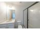 Clean bathroom with white subway tile and a frameless shower at 5470 Crow Dr, Cumming, GA 30041