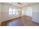 Bright dining room featuring hardwood floors and a unique light fixture at 5470 Crow Dr, Cumming, GA 30041