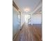 Bright entryway with hardwood floors and view to staircase at 5470 Crow Dr, Cumming, GA 30041