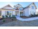Two story home with white siding, gray shutters, and a covered porch at 5470 Crow Dr, Cumming, GA 30041