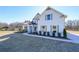 House exterior showcasing a landscaped yard and walkway at 5470 Crow Dr, Cumming, GA 30041