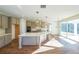 Spacious kitchen with large island, stainless steel appliances, and hardwood floors at 5470 Crow Dr, Cumming, GA 30041