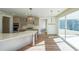 Open concept kitchen boasts a large island and access to outdoor patio at 5470 Crow Dr, Cumming, GA 30041