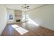 Spacious living room with hardwood floors and stone fireplace at 5470 Crow Dr, Cumming, GA 30041